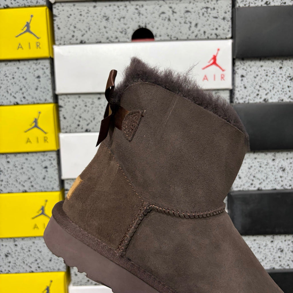 UGG Mini Bailey Bow Ankle Boot – Suede Boot with Tonal Dark Shearling Lining, Chocolate Satin Bow & Dark Sugar Sole in Chocolate